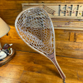 Close-up of the wooden handle on the landing net